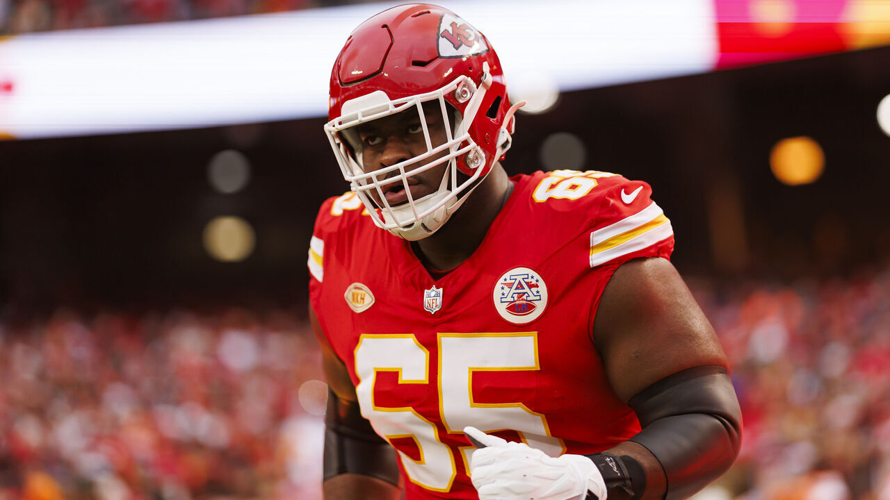 KANSAS CITY, MISSOURI - DECEMBER 31: Trey Smith #65 of the Kansas City Chiefs runs onto the field during player introductions before an NFL football game against the Cincinnati Bengals at GEHA Field at Arrowhead Stadium on December 31, 2023 in Kansas City, Missouri.