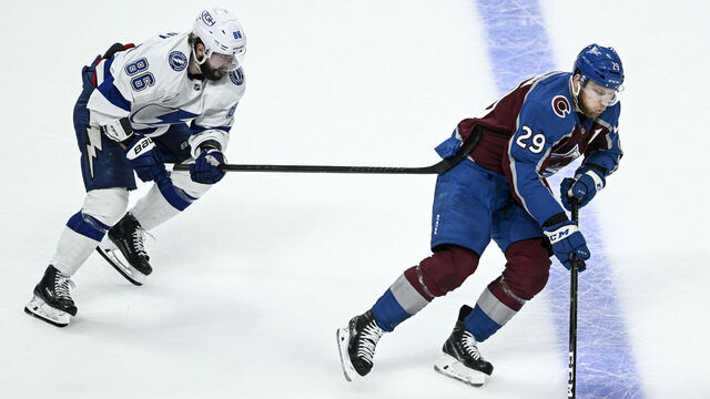 DENVER, CO - JUNE 24: Nathan MacKinnon (29) of the Colorado Avalanche handles the puck as Nikita Kucherov (86) of the Tampa Bay Lightning defends during the second period at Ball Arena in Denver on Friday, June 24, 2022. The Colorado Avalanche versus the Tampa Bay Lightning for game five of the Stanley Cup Finals led 3-1 by Colorado.