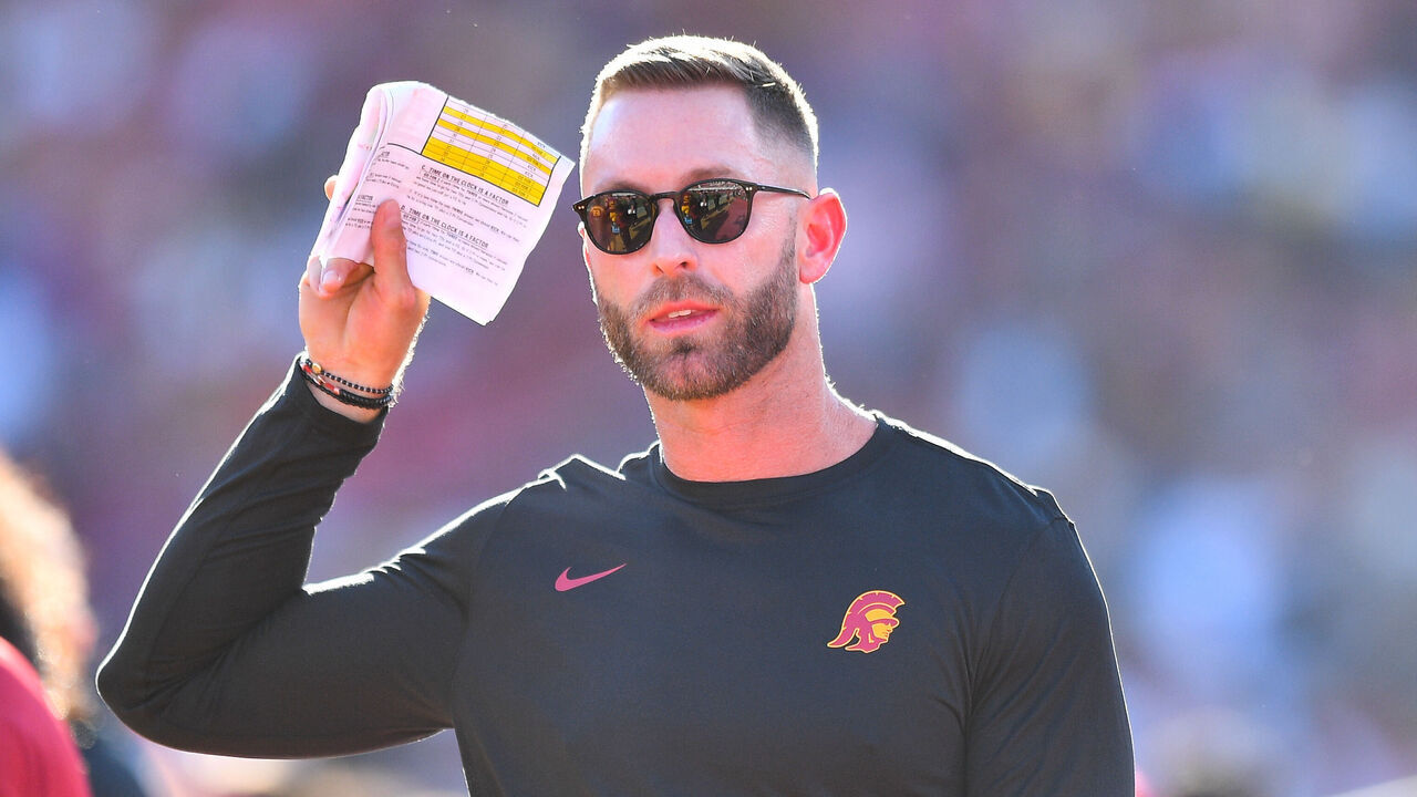 LOS ANGELES, CA - AUGUST 26: USC Trojans senior offensive analyst Kliff Kingsbury looks on during a game between the San Jose State Spartans and the USC Trojans on August 26, 2023, at Los Angeles Memorial Coliseum in Los Angeles, CA.