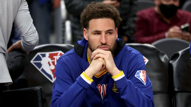 SAN FRANCISCO, CALIFORNIA - MARCH 16: A dejected Golden State Warriors' Klay Thompson (11) remains seated in the bench after they lost 88-110 to the Boston Celtics at Chase Center in San Francisco, Calif., on Wednesday, March 16, 2022.