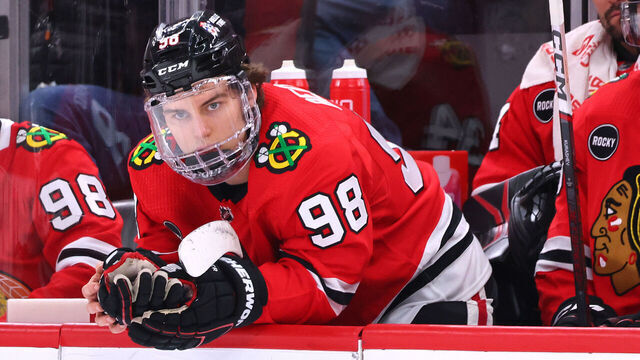 CHICAGO, ILLINOIS - FEBRUARY 15: Connor Bedard #98 of the Chicago Blackhawks reacts on the bench after losing to the Pittsburgh Penguins at the United Center on February 15, 2024 in Chicago, Illinois.