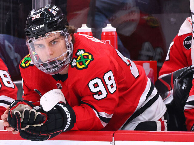 CHICAGO, ILLINOIS - FEBRUARY 15: Connor Bedard #98 of the Chicago Blackhawks reacts on the bench after losing to the Pittsburgh Penguins at the United Center on February 15, 2024 in Chicago, Illinois.