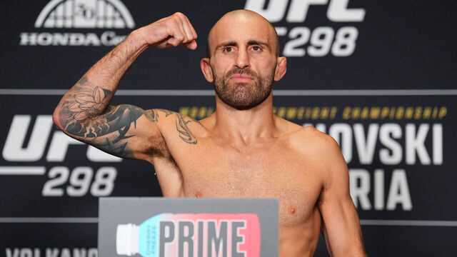 ANAHEIM, CALIFORNIA - FEBRUARY 16: Alexander Volkanovski of Australia poses on the scale during the UFC 298 official weigh-in at the Hyatt Regency Irvine on February 16, 2024 in Irvine, California.