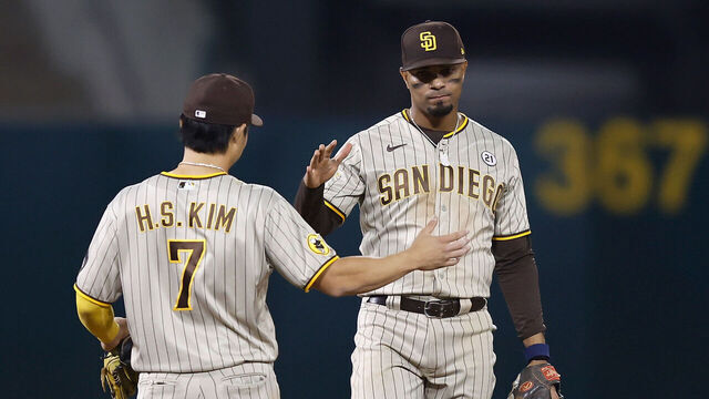OAKLAND, CALIFORNIA - SEPTEMBER 15: Ha-Seong Kim #7 and Xander Bogaerts #2 of the San Diego Padres celebrate after a win against the Oakland Athletics at RingCentral Coliseum on September 15, 2023 in Oakland, California.