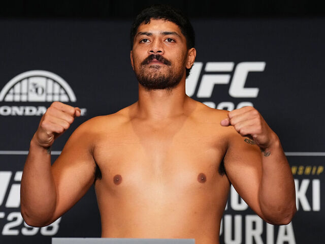 ANAHEIM, CALIFORNIA - FEBRUARY 16: Junior Tafa of New Zealand poses on the scale during the UFC 298 official weigh-in at the Hyatt Regency Irvine on February 16, 2024 in Irvine, California.