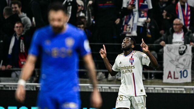 Lyon's Belgian midfielder #25 Orel Mangala (R) celebrates scoring his team's first goal during the French L1 football match between Olympique Lyonnais (OL) and OGC Nice at the Groupama Stadium in Decines-Charpieu, central eastern France, on February 16, 2024.