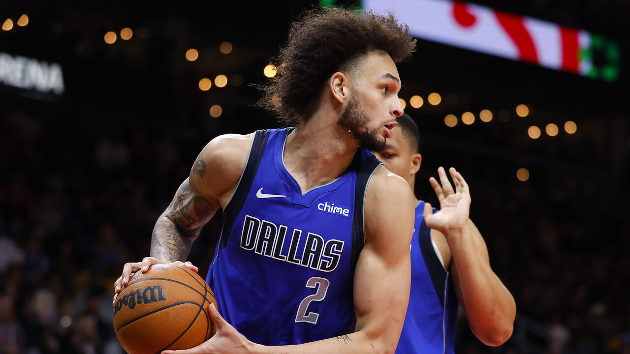 ATLANTA, GEORGIA - JANUARY 26: Dereck Lively II #2 of the Dallas Mavericks rebounds during the fourth quarter against the Atlanta Hawks at State Farm Arena on January 26, 2024 in Atlanta, Georgia.
