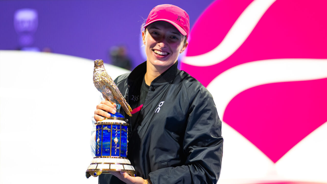 DOHA, QATAR - FEBRUARY 17: Iga Swiatek of Poland poses with the champions trophy after defeating Elena Rybakina of Kazakhstan in the singles final on Day 7 of the Qatar TotalEnergies Open, part of the Hologic WTA Tour at Khalifa International Tennis and Squash Complex on February 17, 2024 in Doha, Qatar