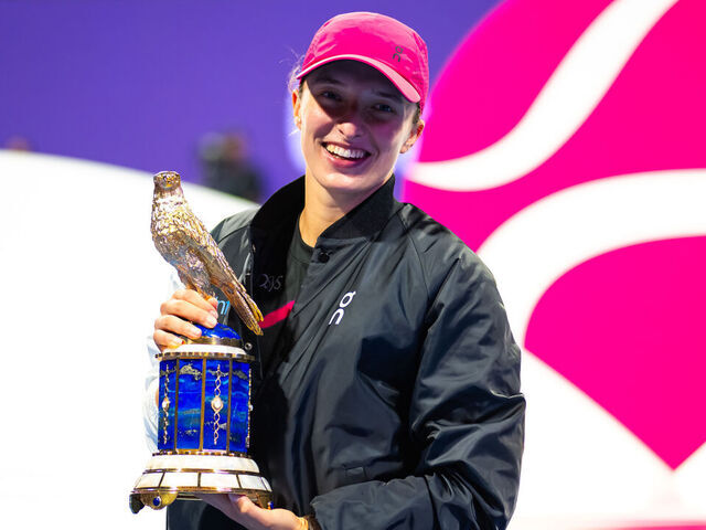 DOHA, QATAR - FEBRUARY 17: Iga Swiatek of Poland poses with the champions trophy after defeating Elena Rybakina of Kazakhstan in the singles final on Day 7 of the Qatar TotalEnergies Open, part of the Hologic WTA Tour at Khalifa International Tennis and Squash Complex on February 17, 2024 in Doha, Qatar