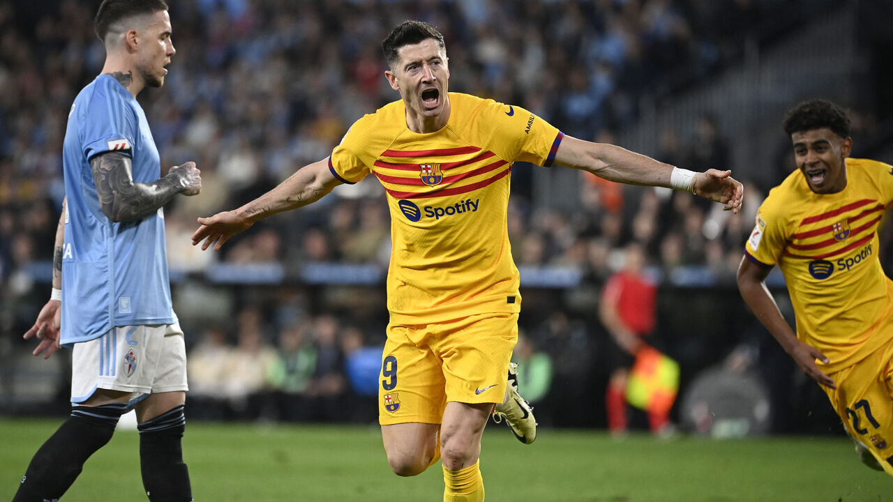 Barcelona's Polish forward #09 Robert Lewandowski celebrates scoring his team's first goal during the Spanish league football match between RC Celta de Vigo and FC Barcelona at the Balaidos stadium in Vigo on February 17, 2024.