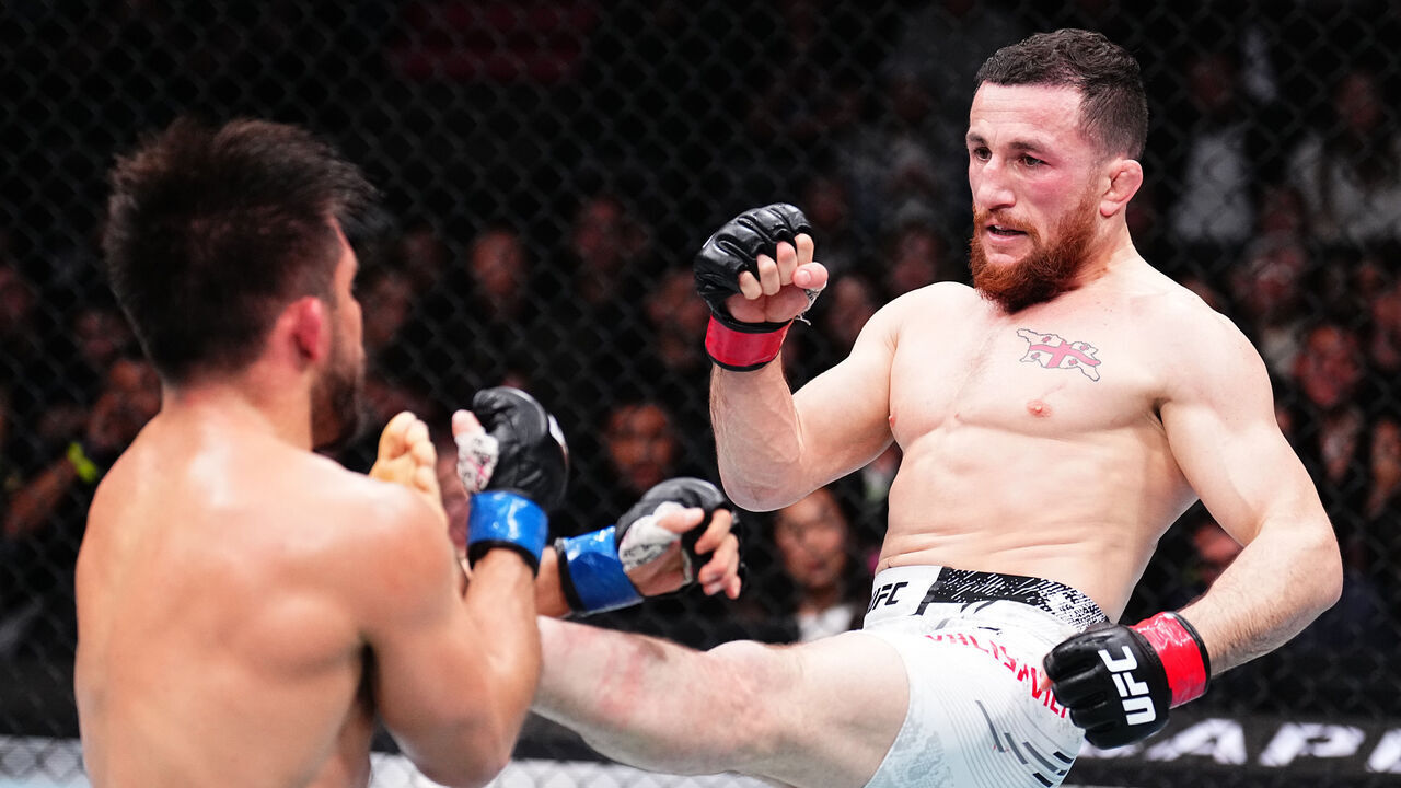 ANAHEIM, CALIFORNIA - FEBRUARY 17: (R-L) Merab Dvalishvili of Georgia kicks Henry Cejudo in a bantamweight fight during the UFC 298 event at Honda Center on February 17, 2024 in Anaheim, California.
