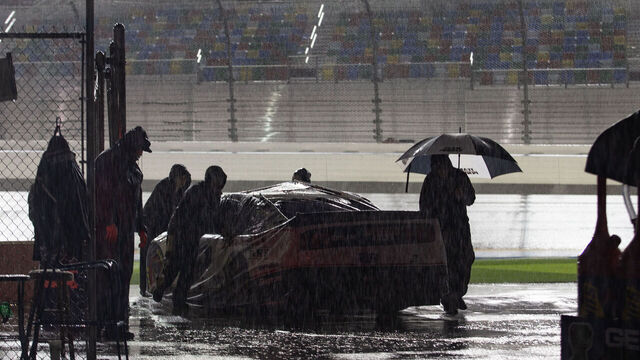 DAYTONA, FL - FEBRUARY 16: Crew members push the car of Brad Keselowski, driver of the #2 Team Penske Discount Tire Ford Mustang, after rain postponed the Daytona 500 on February 16, 2020 at Daytona International Speedway in Daytona Beach, Fl.