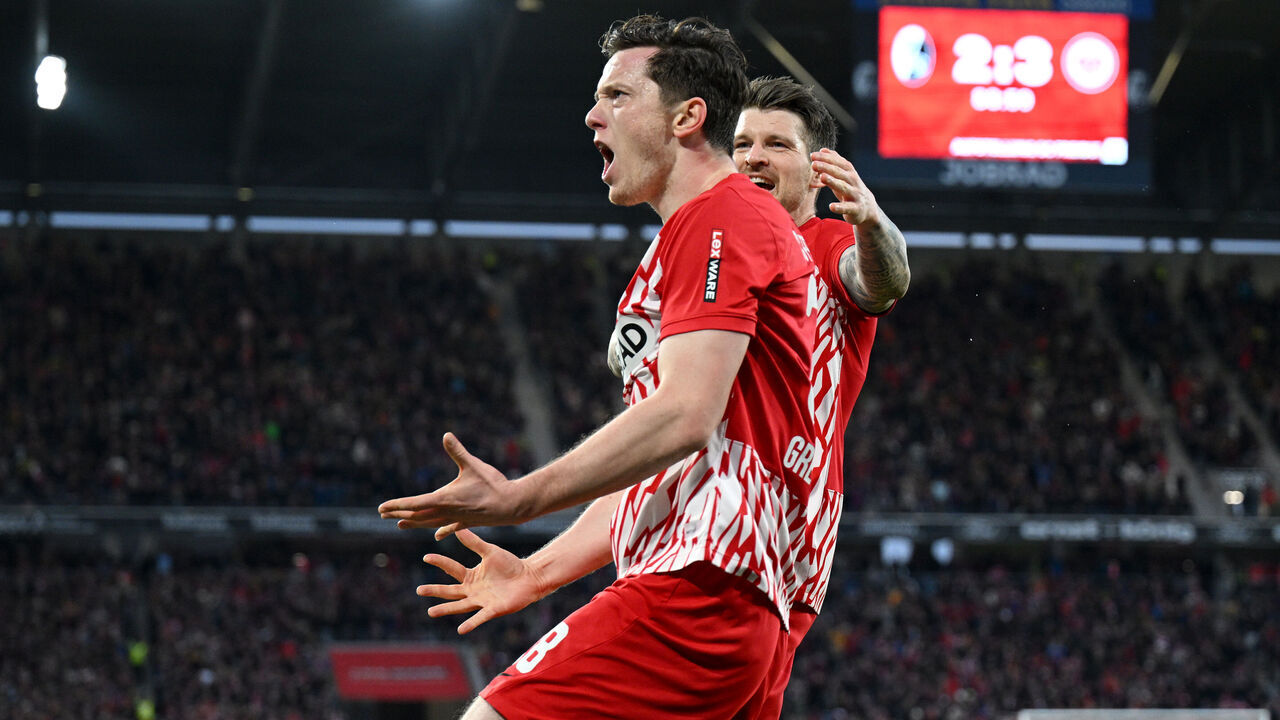 FREIBURG IM BREISGAU, GERMANY - FEBRUARY 18: Michael Gregoritsch of SC Freiburg celebrates scoring his team's third goal during the Bundesliga match between Sport-Club Freiburg and Eintracht Frankfurt at Europa-Park Stadion on February 18, 2024 in Freiburg im Breisgau, Germany.