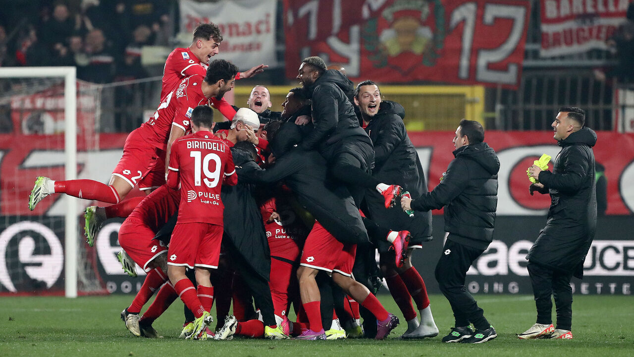 MONZA, ITALY - FEBRUARY 18: Warren Bondo of AC Monza (obscured) celebrates scoring his team's third goal with teammates during the Serie A TIM match between AC Monza and AC Milan - Serie A TIM at U-Power Stadium on February 18, 2024 in Monza, Italy.