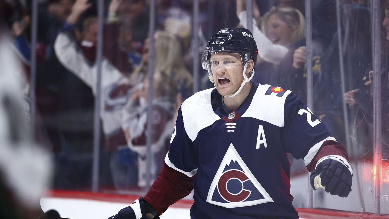 DENVER, COLORADO - FEBRUARY 18: Nathan MacKinnon #29 of the Colorado Avalanche reacts after scoring on the Arizona Coyotes in the second period at Ball Arena on February 18, 2024 in Denver, Colorado.