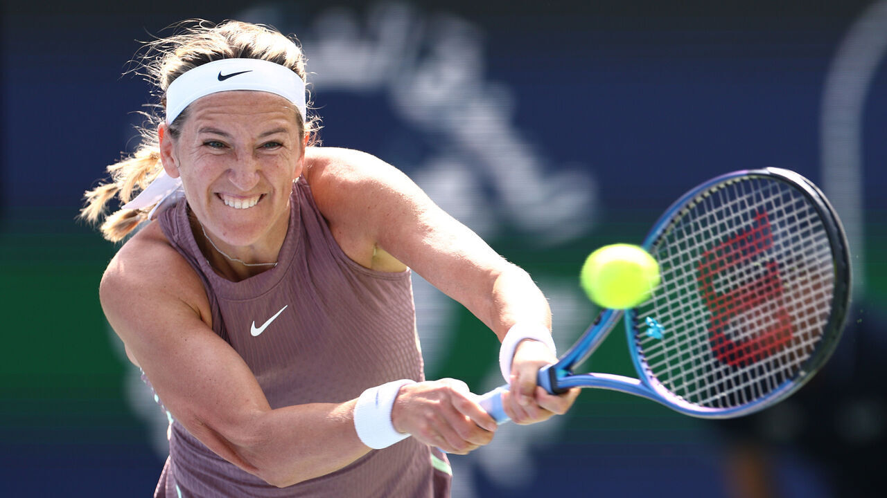 DUBAI, UNITED ARAB EMIRATES - FEBRUARY 19:Victoria Azarenka plays a backhand against Arantxa Rus of The Netherlands in their first round women's singles match during the Dubai Duty Free Tennis Championships, part of the Hologic WTA Tour at Dubai Duty Free Tennis Stadium on February 19, 2024 in Dubai, United Arab Emirates.