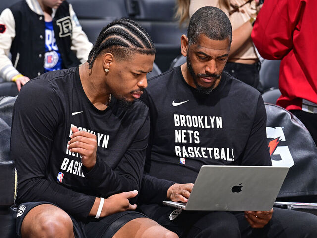 LOS ANGELES, CA - JANUARY 21: Dennis Smith Jr. #4 and Assistant Coach Kevin Ollie of the Brooklyn Nets look at film before the game against the LA Clippers on January 21, 2024 at Crypto.Com Arena in Los Angeles, California. NOTE TO USER: User expressly acknowledges and agrees that, by downloading and/or using this Photograph, user is consenting to the terms and conditions of the Getty Images License Agreement. Mandatory Copyright Notice: Copyright 2024 NBAE