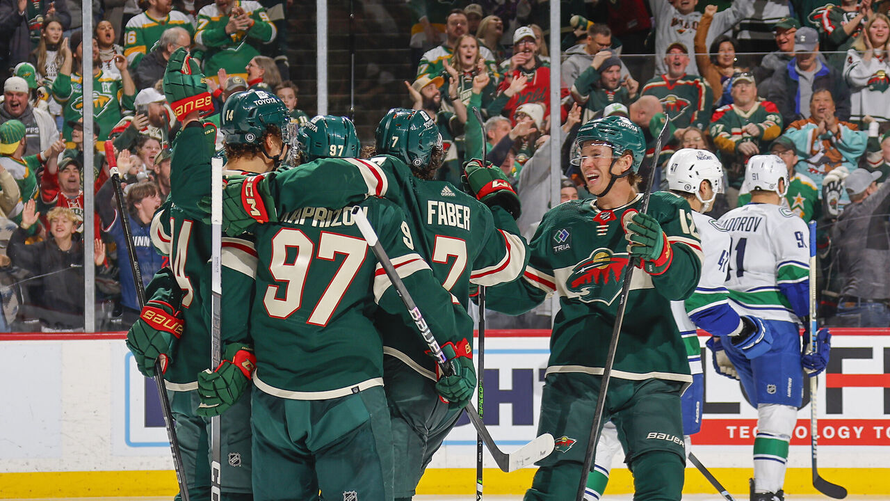 SAINT PAUL, MN - FEBRUARY 19: Joel Eriksson Ek #14, Kirill Kaprizov #97, Brock Faber #7 and Matt Boldy #12 of the Minnesota Wild celebrate after scoring a goal against the Vancouver Canucks during the game at the Xcel Energy Center on February 19, 2024 in Saint Paul, Minnesota.