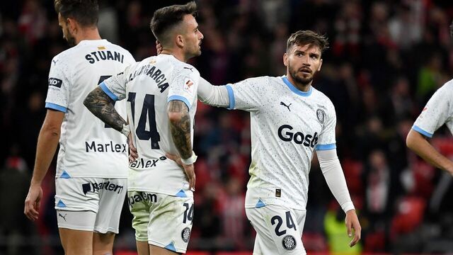 Girona's Spanish midfielder #14 Aleix Garcia, Girona's Spanish forward #24 Cristian Portugues and Girona's Spanish defender #03 Miguel Gutierrez react at the end of the Spanish league football match between Athletic Club Bilbao and Girona FC at the San Mames stadium in Bilbao on February 19, 2024.