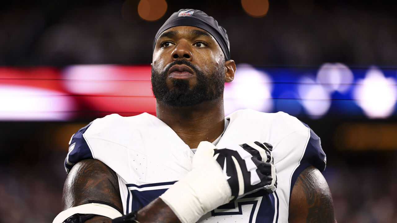 ARLINGTON, TX - DECEMBER 10: Tyron Smith #77 of the Dallas Cowboys stands on the sidelines during the national anthem prior to an NFL football game against the Philadelphia Eagles at AT&T Stadium on December 10, 2023 in Arlington, Texas.