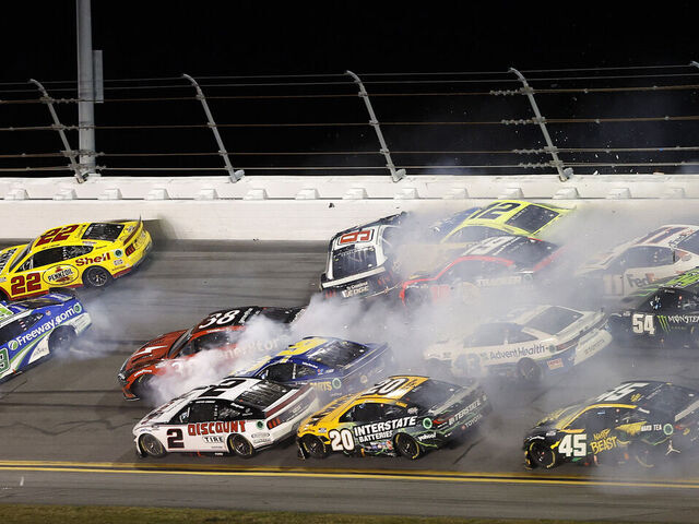DAYTONA BEACH, FLORIDA - FEBRUARY 19: Joey Logano, driver of the #22 Shell Pennzoil Ford, Todd Gilliland, driver of the #38 gener8tor Ford, Brad Keselowski, driver of the #6 Castrol Edge Ford, Martin Truex Jr., driver of the #19 Bass Pro Shops Toyota, Ryan Blaney, driver of the #12 Menards/PEAK Ford, and Ty Gibbs, driver of the #54 Monster Energy Toyota, spin after an on-track incident during the NASCAR Cup Series Daytona 500 at Daytona International Speedway on February 19, 2024 in Daytona Beach, Florida.