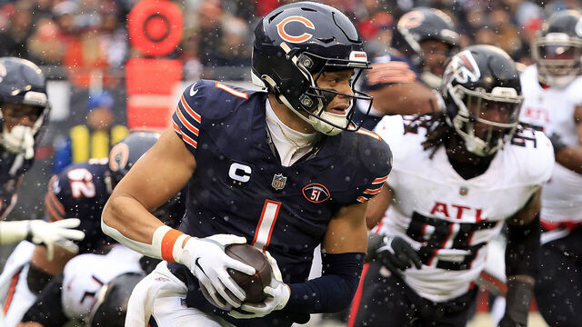 CHICAGO, ILLINOIS - DECEMBER 31: Justin Fields #1 of the Chicago Bears runs the ball during the first half against the Atlanta Falcons at Soldier Field on December 31, 2023 in Chicago, Illinois.