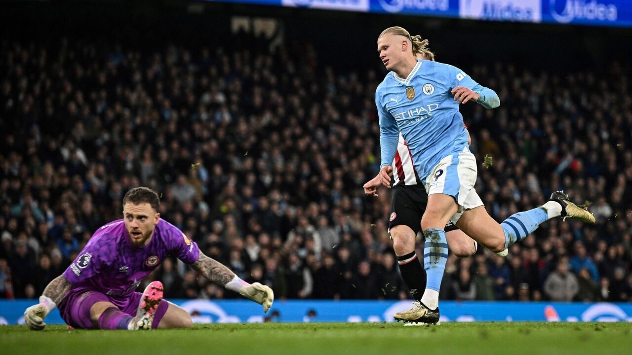 Manchester City's Norwegian striker #09 Erling Haaland (L) celebrates after scoring his team first goal during the English Premier League football match between Manchester City and Brentford at the Etihad Stadium in Manchester, north west England, on February 20, 2024.