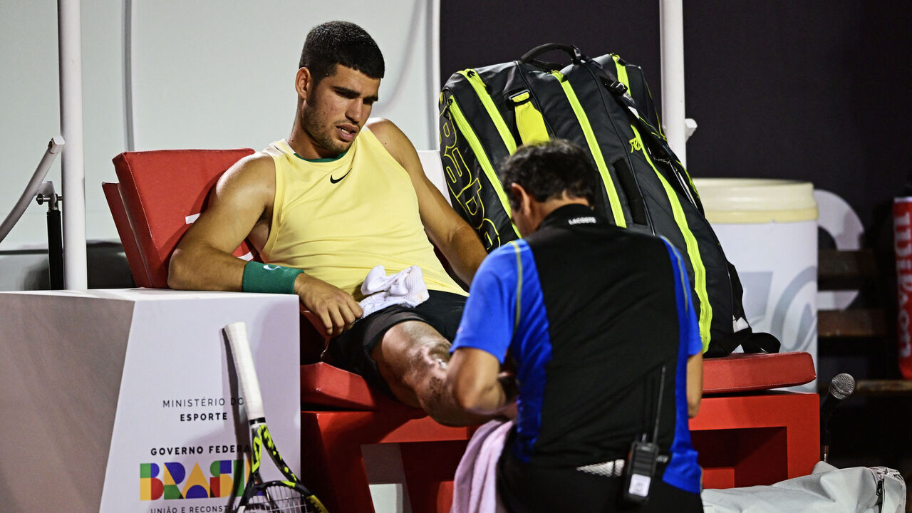Spain's Carlos Alcaraz gestures after suffering an injury during the ATP 500 Rio Open tennis match against Brazil's Carlos Monteiro in Rio de Janeiro, Brazil on February 20, 2024.