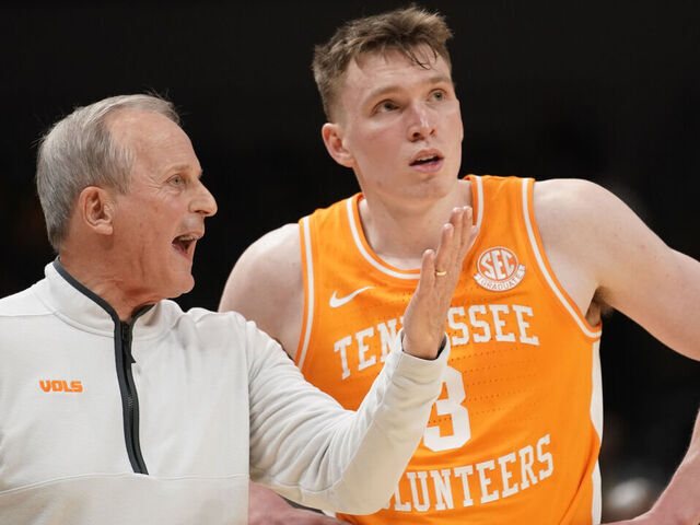 COLUMBIA, MISSOURI - FEBRUARY 20: Head coach Rick Barnes of the Tennessee Volunteers talks with Dalton Knecht #3 during action against the Missouri Tigers in the second half at Mizzou Arena on February 20, 2024 in Columbia, Missouri.