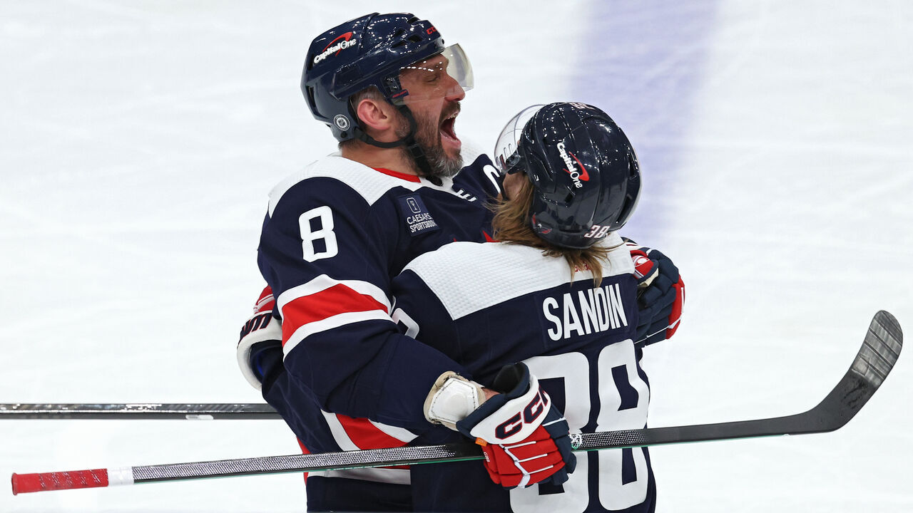 WASHINGTON, DC - FEBRUARY 20: Alex Ovechkin #8 of the Washington Capitals celebrates with teammates after scoring a goal against the New Jersey Devils during the third period at Capital One Arena on February 20, 2024 in Washington, DC.