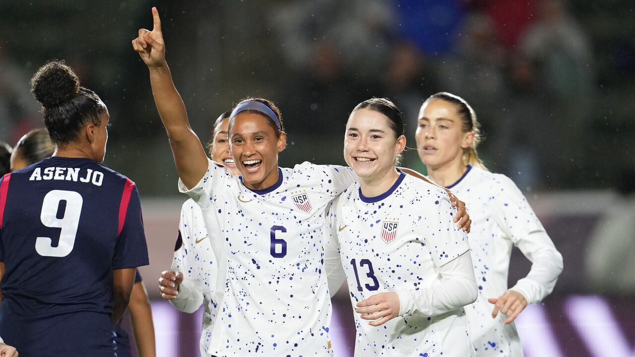 CARSON, CALIFORNIA - FEBRUARY 20: Olivia Moultrie #13 of the United States celebrates scoring with teammate Lynn Williams #6 during the first half of the 2024 Concacaf W Gold Cup Group A match against the Dominican Republic at Dignity Health Sports Park on February 20, 2024 in Carson, California. The goal was later disallowed following a VAR review.