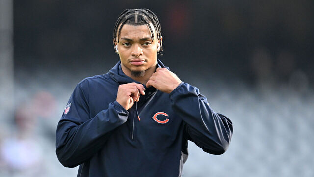CHICAGO, ILLINOIS - DECEMBER 24: Justin Fields #1 of the Chicago Bears warms up before the game against the Arizona Cardinals at Soldier Field on December 24, 2023 in Chicago, Illinois.