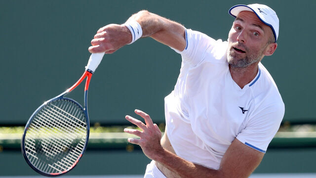 INDIAN WELLS, CALIFORNIA - OCTOBER 05: Ivo Karlovic of Croatia serves to Brayden Schnur of Canada during qualifying for the BNP Paribas Open at the Indian Wells Tennis Garden on October 05, 2021 in Indian Wells, California.