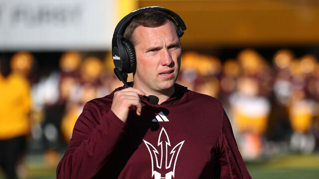 TEMPE, ARIZONA - NOVEMBER 25: Head Coach Kenny Dillingham of the Arizona State Sun Devils talks to his coaches on the headset during the University of Arizona Wildcats versus the Arizona State Sun Devils football game at Mountain America Stadium on November 25, 2023 in Tempe, Arizona.