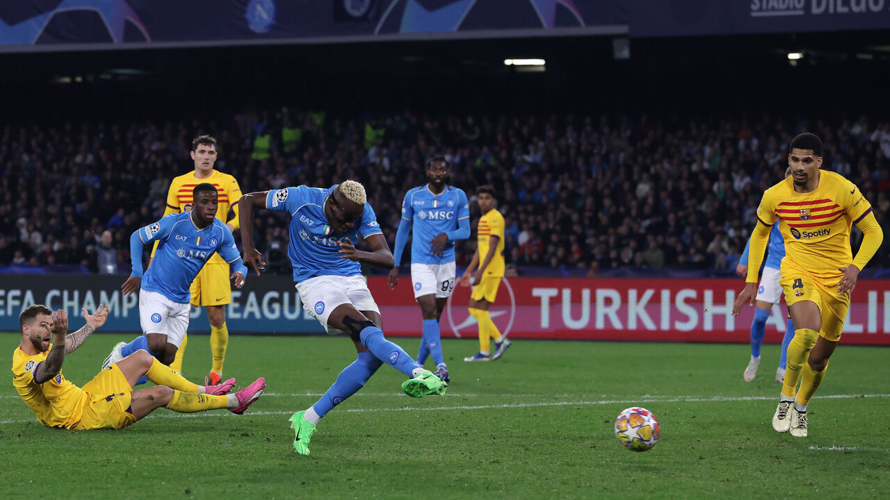 NAPLES, ITALY - FEBRUARY 21: Victor Osimhen of SSC Napoli shoots to score during the UEFA Champions League 2023/24 round of 16 first leg match between SSC Napoli and FC Barcelona at Stadio Diego Armando Maradona on February 21, 2024 in Naples, Italy.