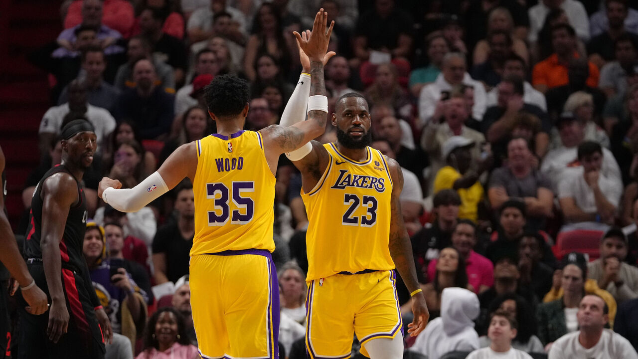 MIAMI, FLORIDA - NOVEMBER 6: LeBron James #23 and Christian Wood #35 of the Los Angeles Lakers high five during the game against the Miami Heat on November 6, 2023 at Kaseya Center in Miami, Florida. Mandatory Copyright Notice: Copyright 2023 NBAE