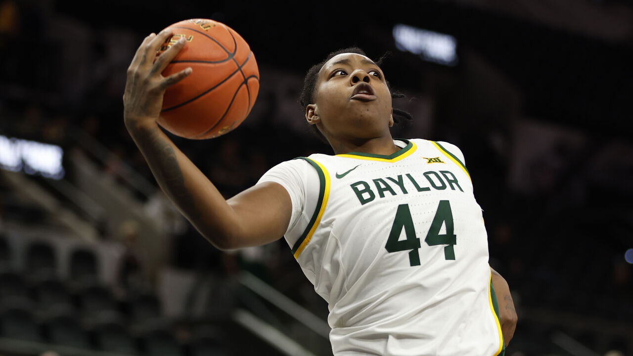SAN ANTONIO, TX - DECEMBER 16: Dre'Una Edwards #44 of the Baylor Bears grabs a rebound against Miami Hurricanes in the second half of the 2023 Hall of Fame Series San Antonio at Frost Bank Center on December 16, 2023 in San Antonio, Texas.