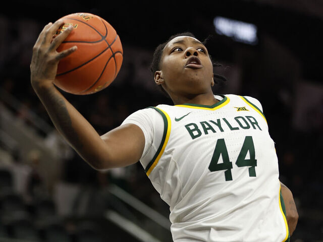 SAN ANTONIO, TX - DECEMBER 16: Dre'Una Edwards #44 of the Baylor Bears grabs a rebound against Miami Hurricanes in the second half of the 2023 Hall of Fame Series San Antonio at Frost Bank Center on December 16, 2023 in San Antonio, Texas.