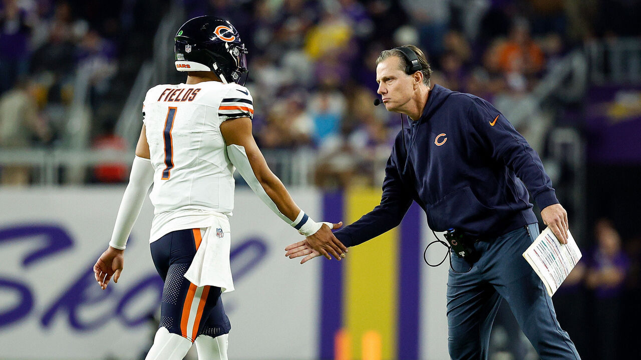 MINNEAPOLIS, MINNESOTA - NOVEMBER 27: Justin Fields #1 and head coach Matt Eberflus of the Chicago Bears interact in the first half against the Minnesota Vikings at U.S. Bank Stadium on November 27, 2023 in Minneapolis, Minnesota. The Bears defeated the Vikings 12-10.