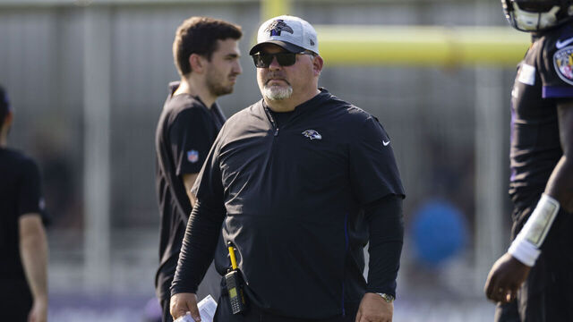 OWINGS MILLS, MD - JULY 28: Offensive coordinator Greg Roman of the Baltimore Ravens watches play during training camp at Under Armour Performance Center Baltimore Ravens on July 28, 2021 in Owings Mills, Maryland.