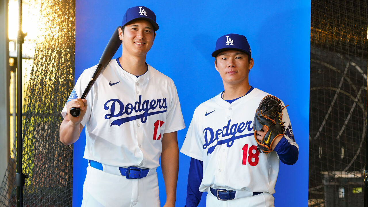 GLENDALE, AZ - FEBRUARY 21: Shohei Ohtani #17 and Yoshinobu Yamamoto #18 of the Los Angeles Dodgers pose for a photo during the Los Angeles Dodgers Photo Day at Camelback Ranch on Wednesday, February 21, 2024 in Glendale, Arizona.