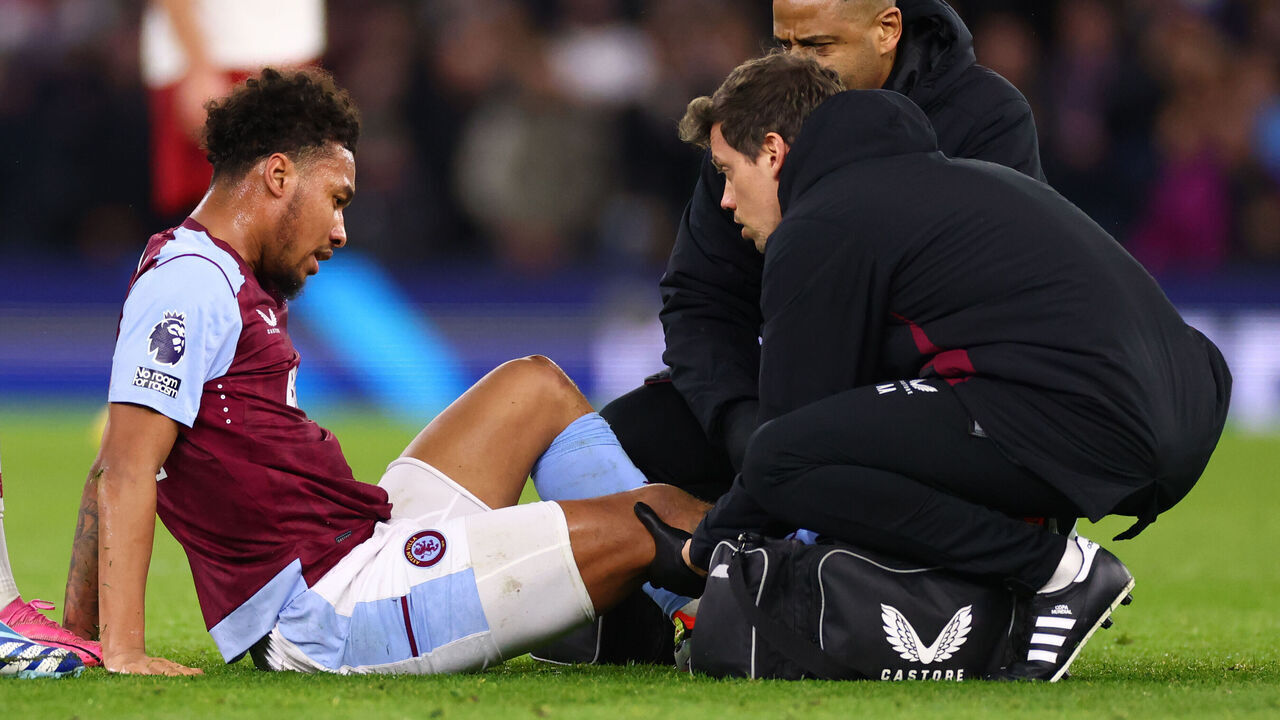 BIRMINGHAM, ENGLAND - FEBRUARY 11: Boubacar Kamara of Aston Villa is treated for a knee injury before being substituted during the Premier League match between Aston Villa and Manchester United at Villa Park on February 11, 2024 in Birmingham, England.