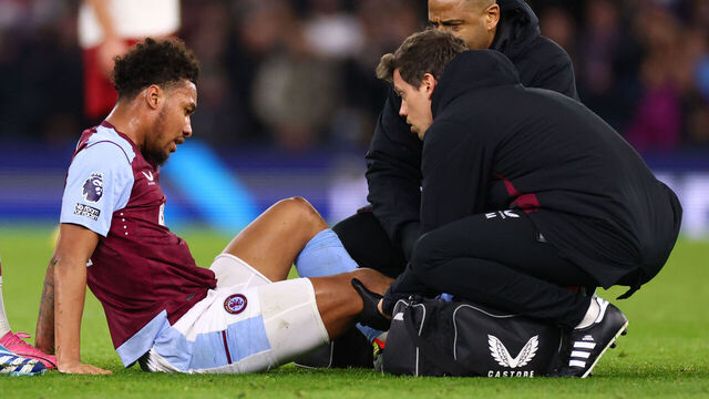 BIRMINGHAM, ENGLAND - FEBRUARY 11: Boubacar Kamara of Aston Villa is treated for a knee injury before being substituted during the Premier League match between Aston Villa and Manchester United at Villa Park on February 11, 2024 in Birmingham, England.