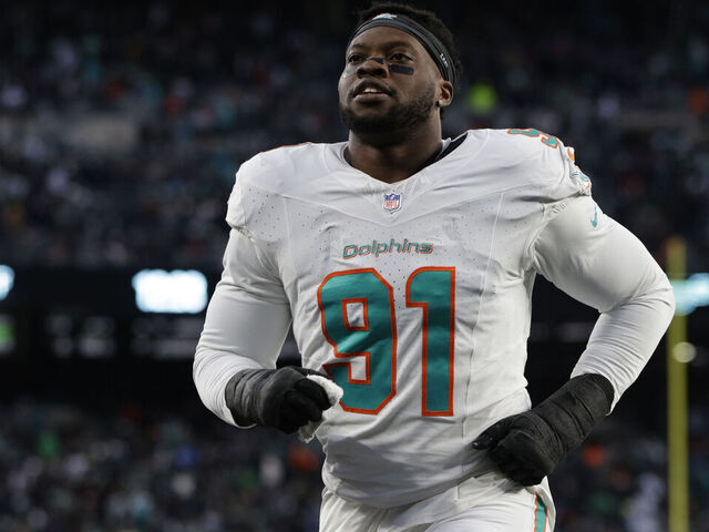 EAST RUTHERFORD, NEW JERSEY - NOVEMBER 24: Defensive end Emmanuel Ogbah #91 of the Miami Dolphins walks off the field at the end of the first half of a football game against the New York Jets at MetLife Stadium on November 24, 2023 in East Rutherford, New Jersey.