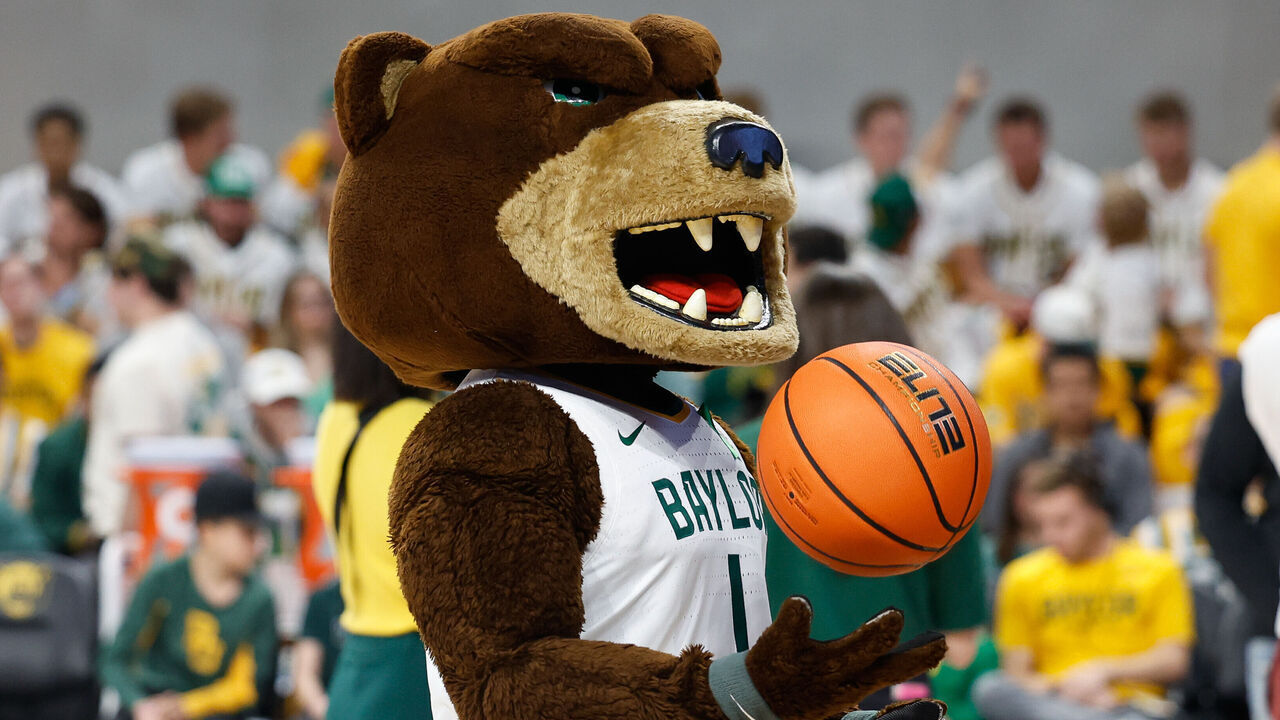 WACO, TX - FEBRUARY 13: Bruiser the mascot tosses a basketball before the Big 12 college basketball game between Baylor Bears and Oklahoma Sooners on February 13, 2024, at Foster Pavilion in Waco, Texas.