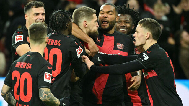 Bayer Leverkusen's German midfielder #08 Robert Andrich (C) celebrates after the 2-1 goal with his team-mates during the German first division Bundesliga football match between Bayer 04 Leverkusen and Mainz 05 in Leverkusen, western Germany on February 23, 2024.