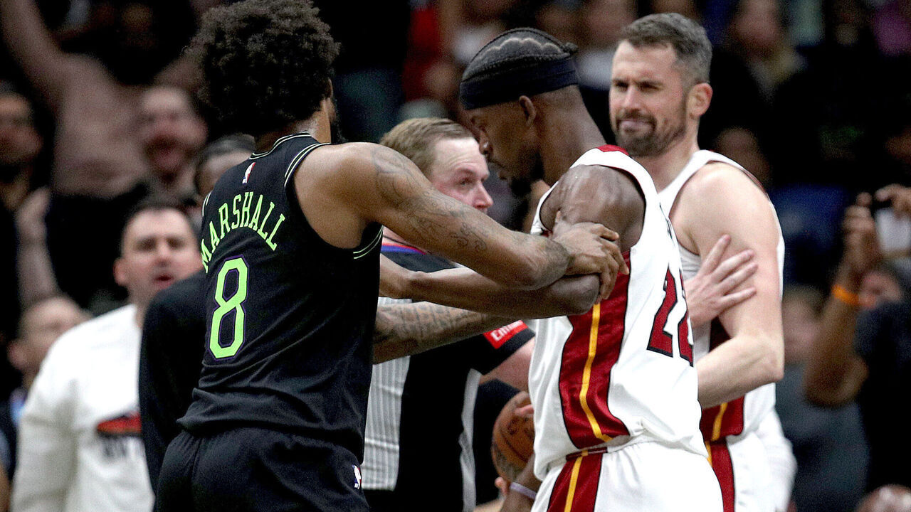 NEW ORLEANS, LOUISIANA - FEBRUARY 23: Naji Marshall #8 of the New Orleans Pelicans and Jimmy Butler #22 of the Miami Heat are involved in an altercation during the fourth quarter of an NBA game at Smoothie King Center on February 23, 2024 in New Orleans, Louisiana. Both players were ejected.