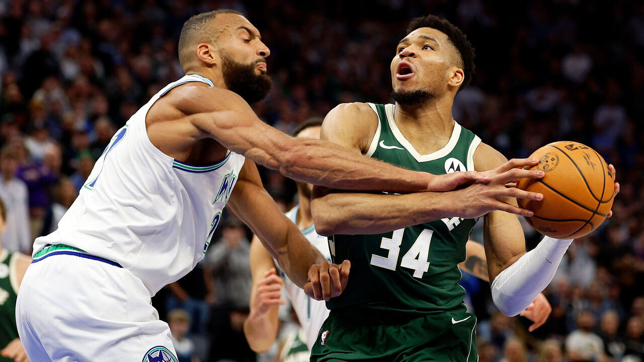 MINNEAPOLIS, MINNESOTA - FEBRUARY 23: Giannis Antetokounmpo #34 of the Milwaukee Bucks is fouled by Rudy Gobert #27 of the Minnesota Timberwolves in the fourth quarter at Target Center on February 23, 2024 in Minneapolis, Minnesota. The Bucks defeated the Timberwolves 112-107.