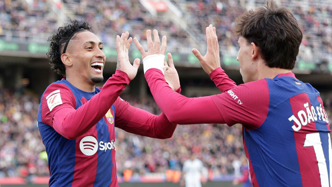 BARCELONA, SPAIN - FEBRUARY 24: Raphinha of FC Barcelona celebrates his goal 1-0 with Joao Felix of FC Barcelona during the LaLiga EA Sports match between FC Barcelona v Getafe at the Lluis Companys Olympic Stadium on February 24, 2024 in Barcelona Spain