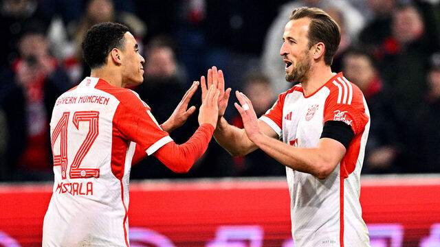24 February 2024, Bavaria, Munich: Soccer: Bundesliga, Bayern Munich - RB Leipzig, Matchday 23, Allianz Arena. Harry Kane of Munich (r) celebrates with Jamal Musiala after his goal to make it 1-0. Photo: Tom Weller/dpa